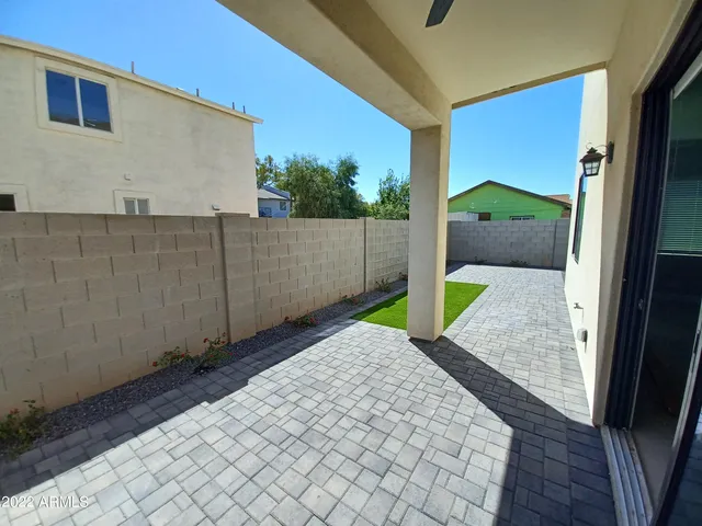 a view of a backyard of the house