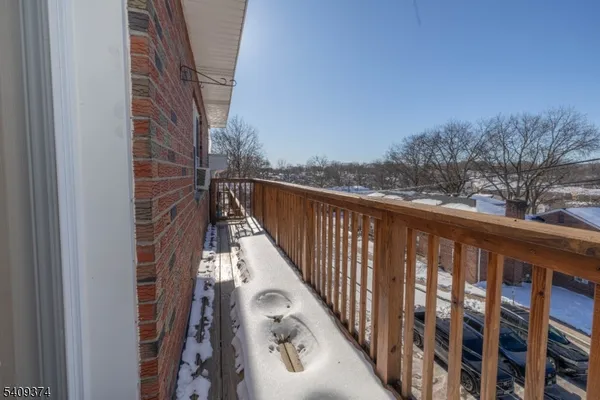 a view of balcony with furniture