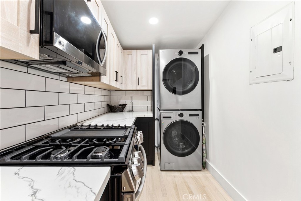 1148 Locust Avenue Long Beach, CA 90813 - Photo 11 of 34 a kitchen with stove top oven and cabinets