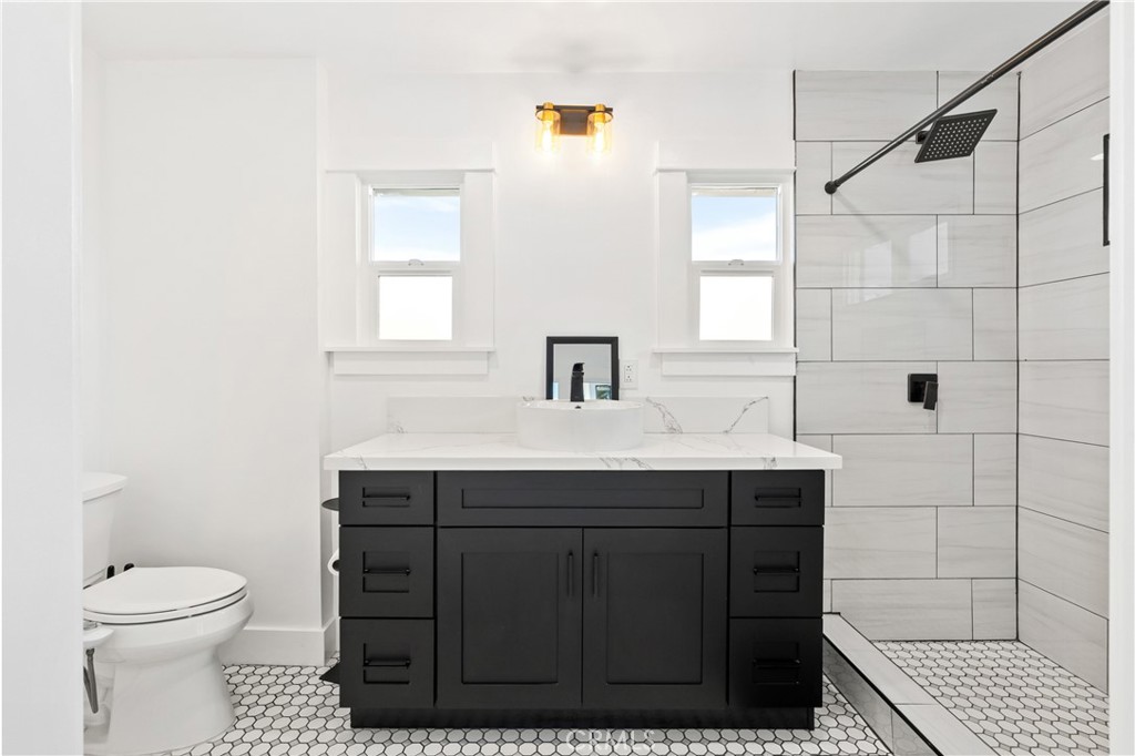 1148 Locust Avenue Long Beach, CA 90813 - Photo 17 of 34 a bathroom with a sink toilet and shower