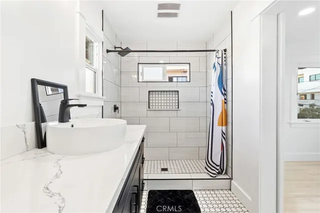 a bathroom with a sink and a shower