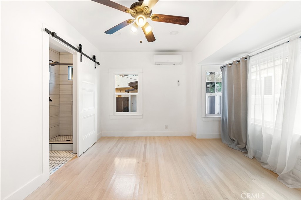 1148 Locust Avenue Long Beach, CA 90813 - Photo 19 of 34 wooden floor in an empty room with a window