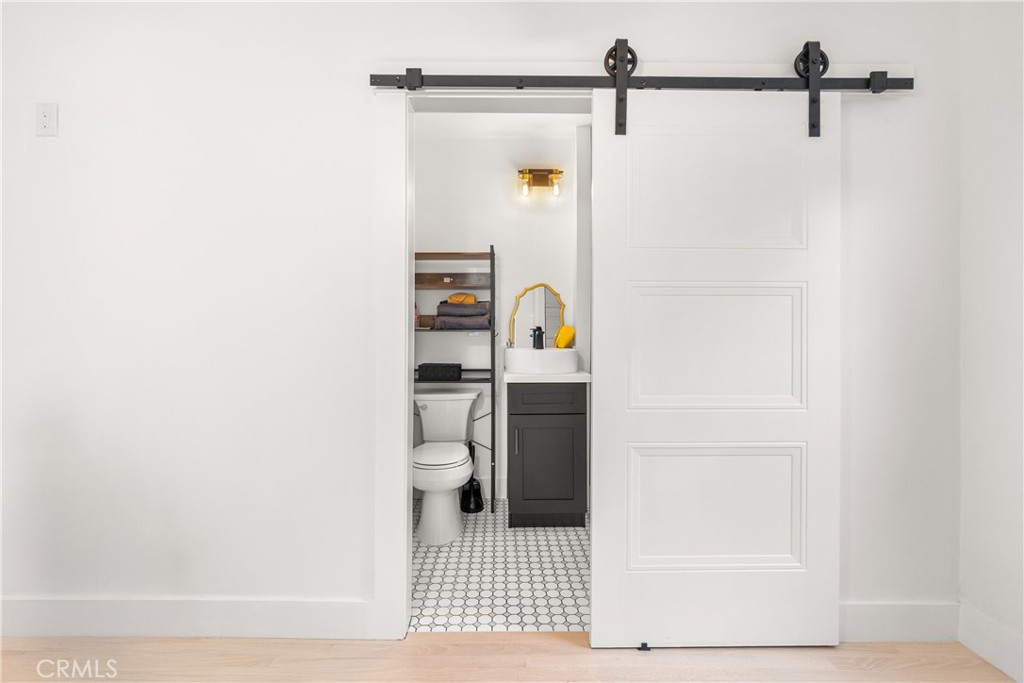 1148 Locust Avenue Long Beach, CA 90813 - Photo 20 of 34 a bathroom with a toilet and a shower