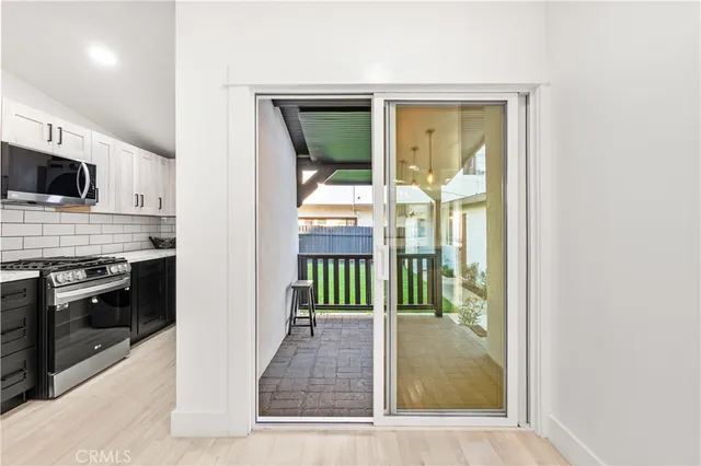 a view of a kitchen from the hallway