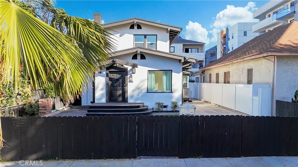 1148 Locust Avenue Long Beach, CA 90813 - Photo 31 of 34 a front view of a house with a yard