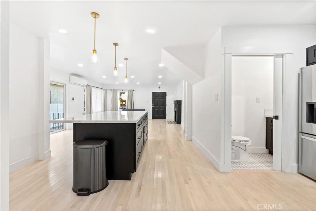 1148 Locust Avenue Long Beach, CA 90813 - Photo 7 of 34 a spacious bathroom with a sink and a mirror