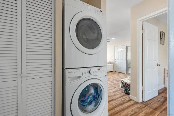 a view of a hallway with washer and dryer