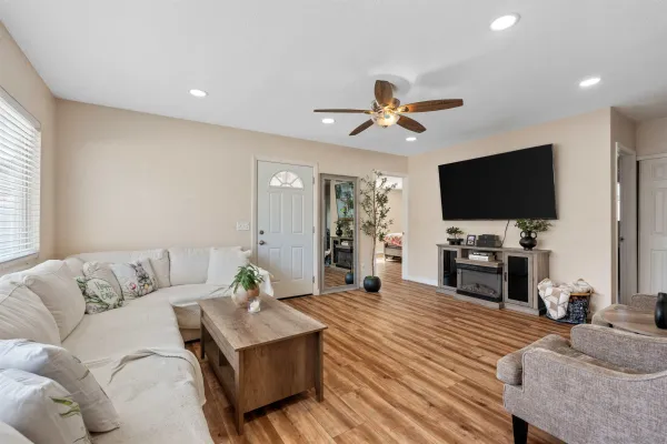 a living room with furniture and a flat screen tv