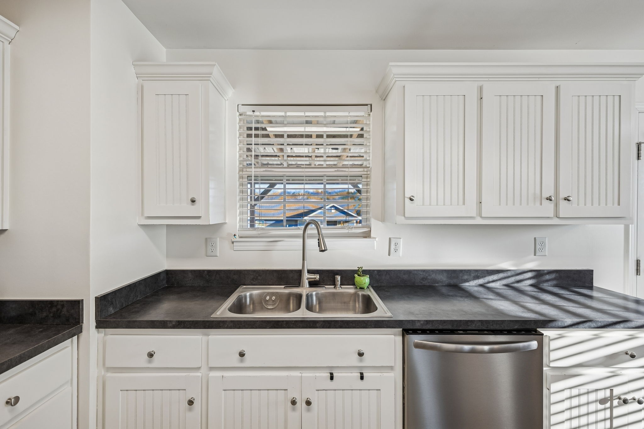 460 Edgewood Street Alexandria, TN 37012 - Photo 11 of 22 a kitchen with granite countertop a sink and cabinets