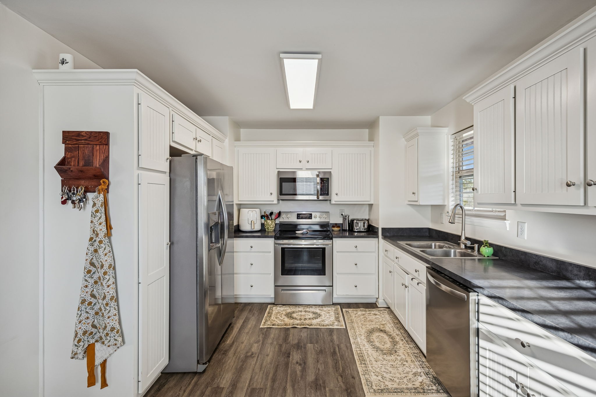 460 Edgewood Street Alexandria, TN 37012 - Photo 12 of 22 a kitchen with stainless steel appliances granite countertop a stove a sink and a refrigerator