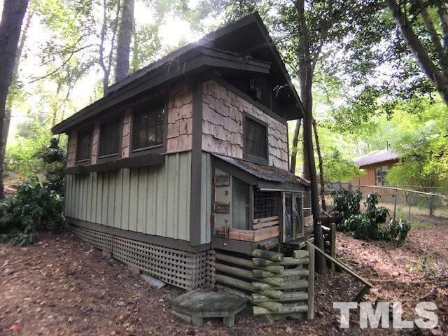 504 Merrie Road Raleigh, NC 27606 - Photo 2 of 25 a house with trees in the background