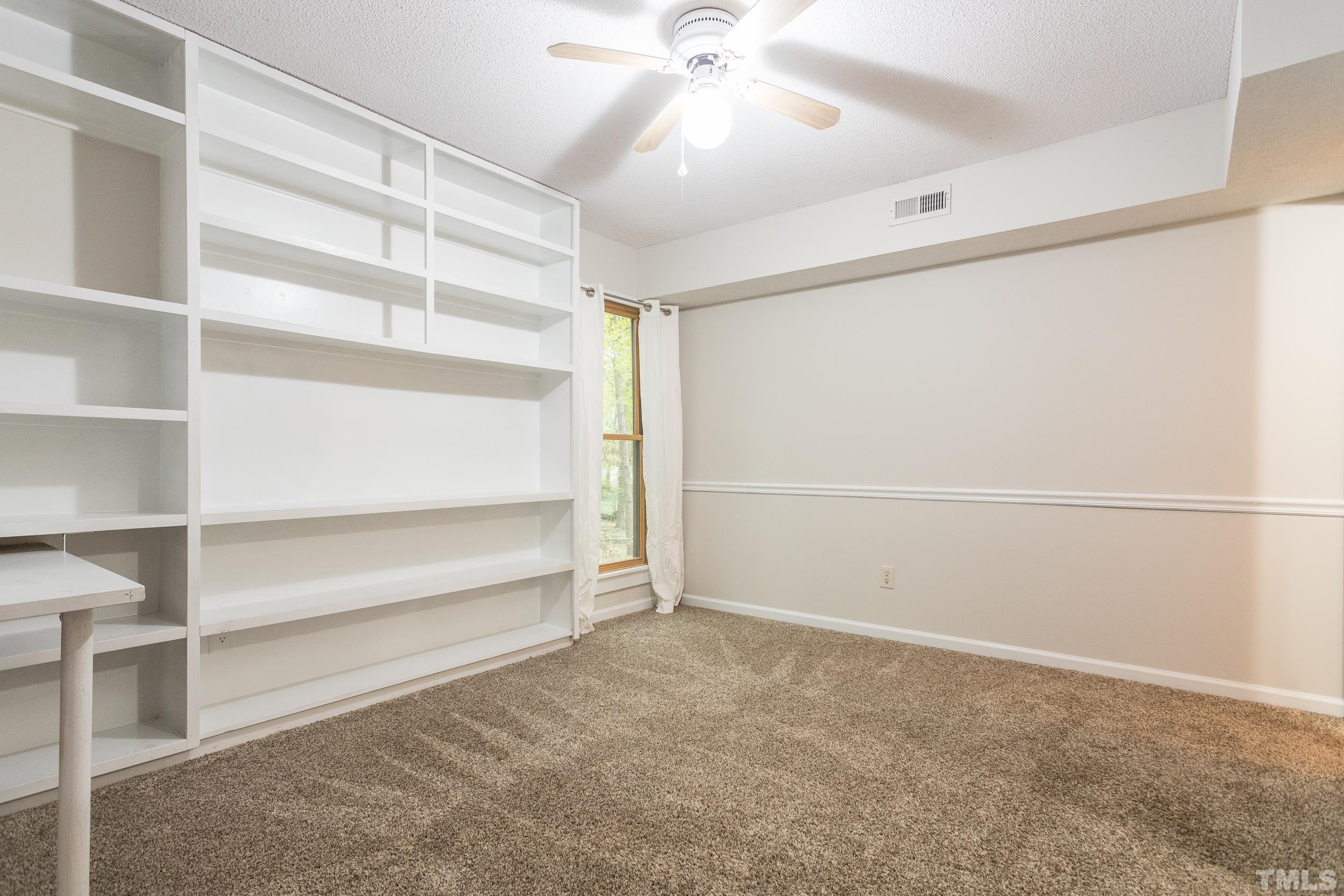 504 Merrie Road Raleigh, NC 27606 - Photo 17 of 25 a view of an empty room with a window
