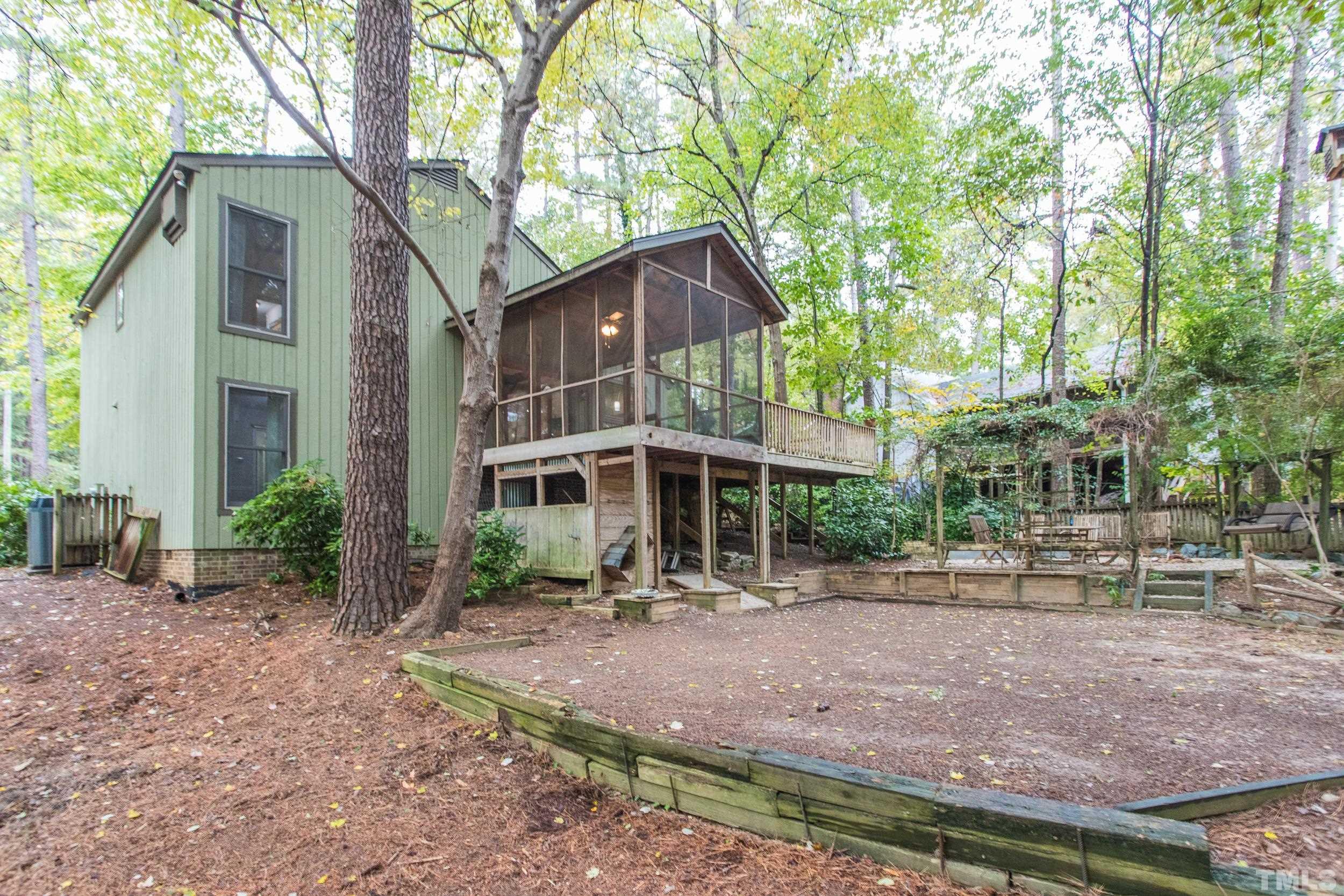 504 Merrie Road Raleigh, NC 27606 - Photo 22 of 25 a front view of a house with garden