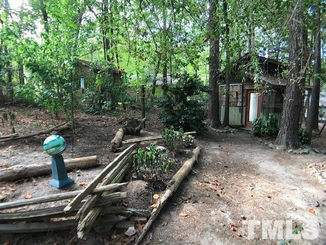 504 Merrie Road Raleigh, NC 27606 - Photo 4 of 25 a view of a house with a backyard space