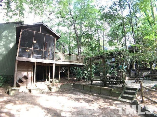 504 Merrie Road Raleigh, NC 27606 - Photo 6 of 25 a view of a house with backyard porch and sitting area