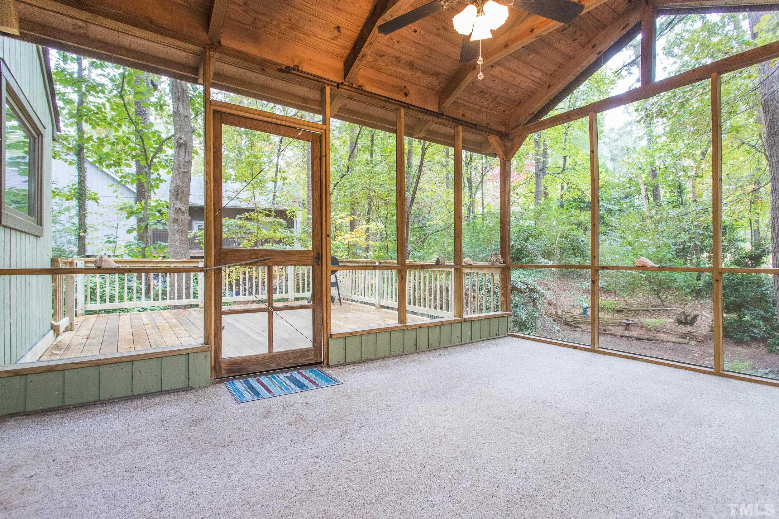 504 Merrie Road Raleigh, NC 27606 - Photo 8 of 25 a view of an empty room with windows