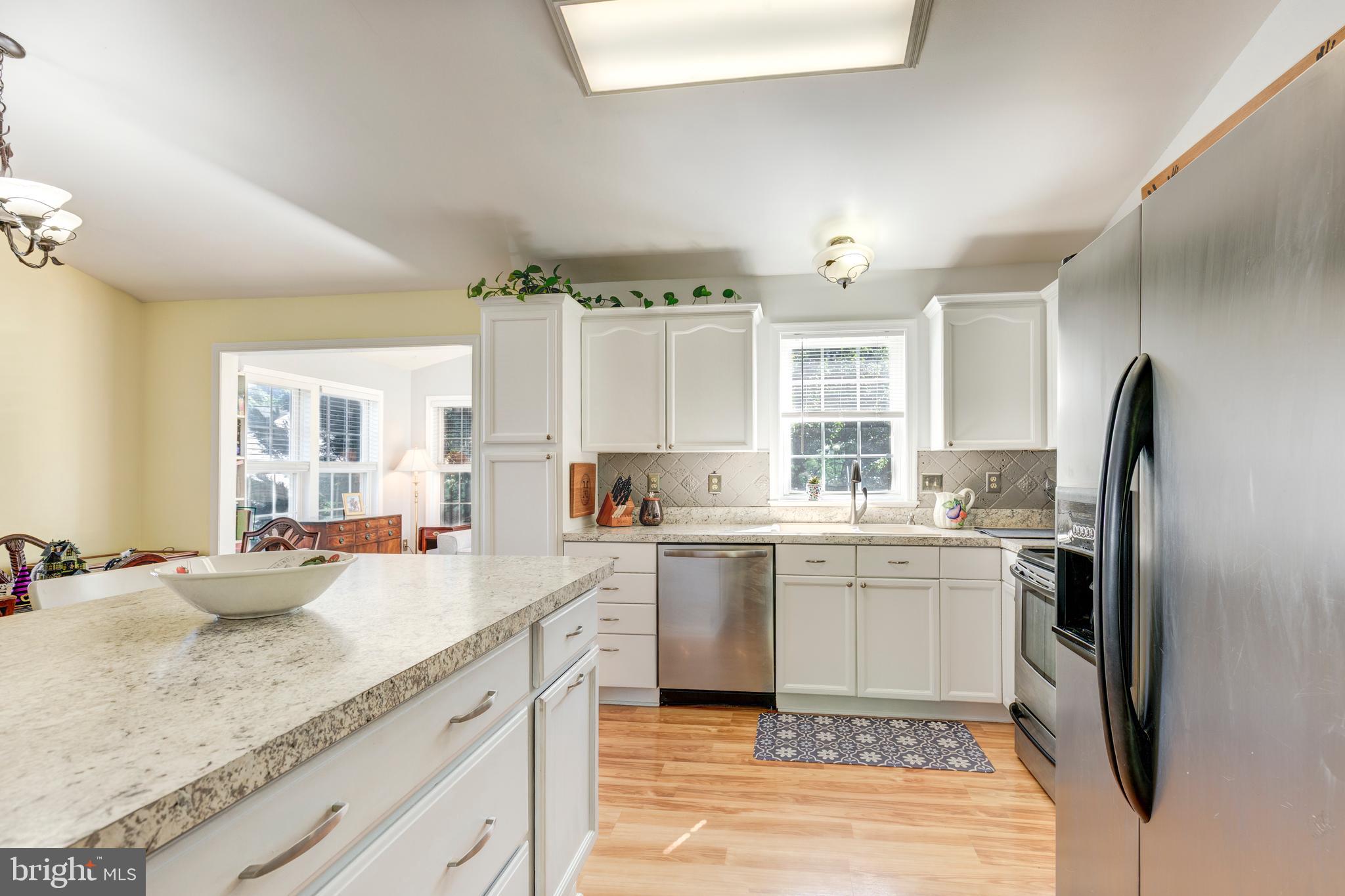 314 Huntinghorn Street Taneytown, MD 21787 - Photo 20 of 47 a kitchen with a sink stove and refrigerator