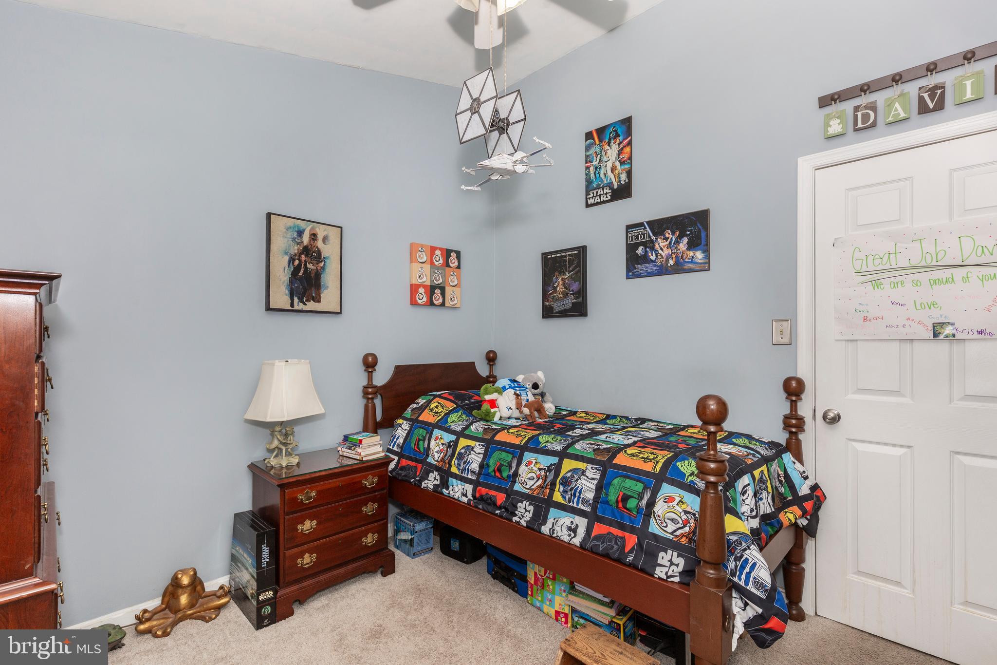 314 Huntinghorn Street Taneytown, MD 21787 - Photo 23 of 47 a bedroom with a bed and dresser with the shoe rack