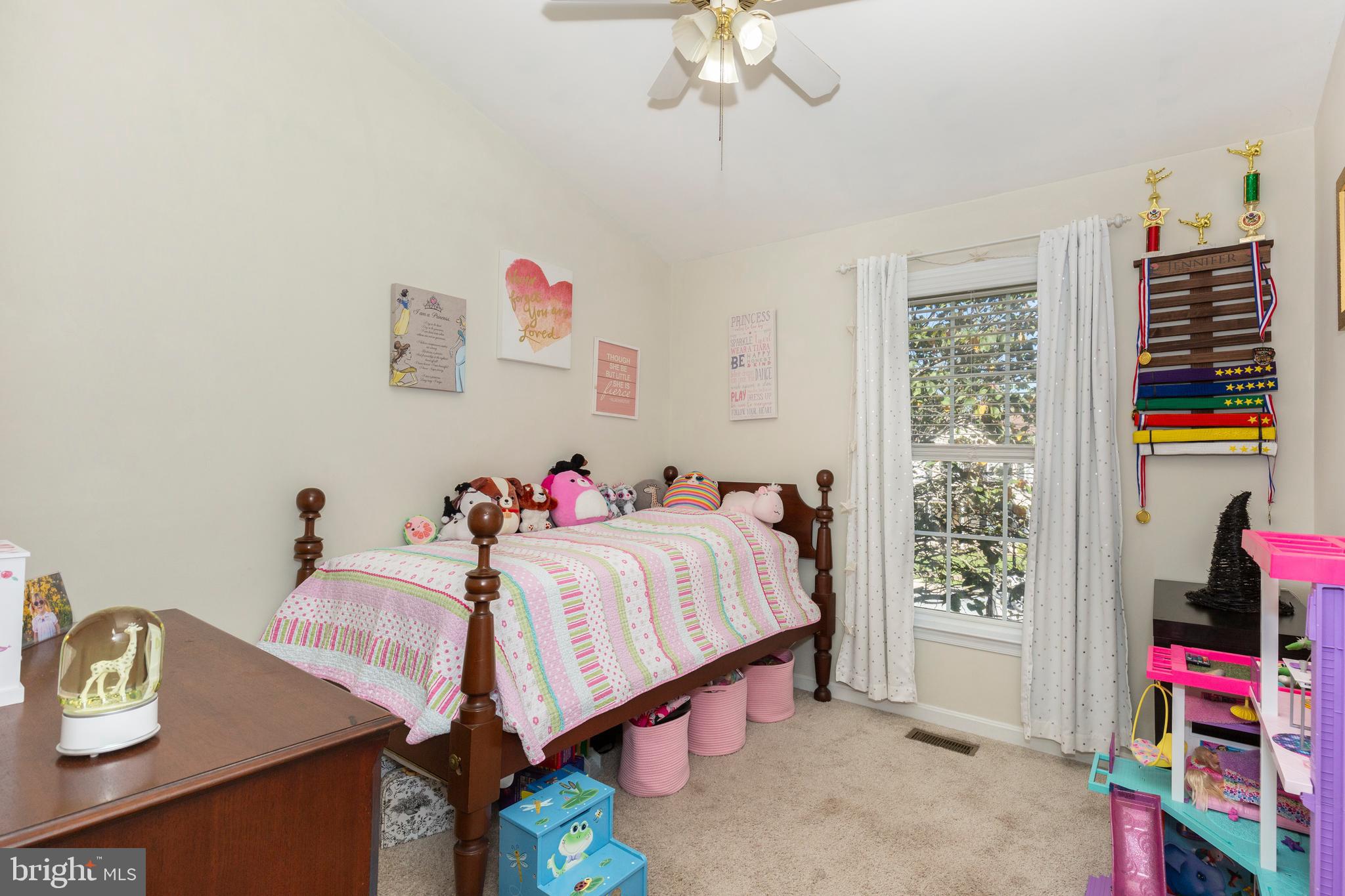314 Huntinghorn Street Taneytown, MD 21787 - Photo 24 of 47 a bedroom with a bed and a chandelier
