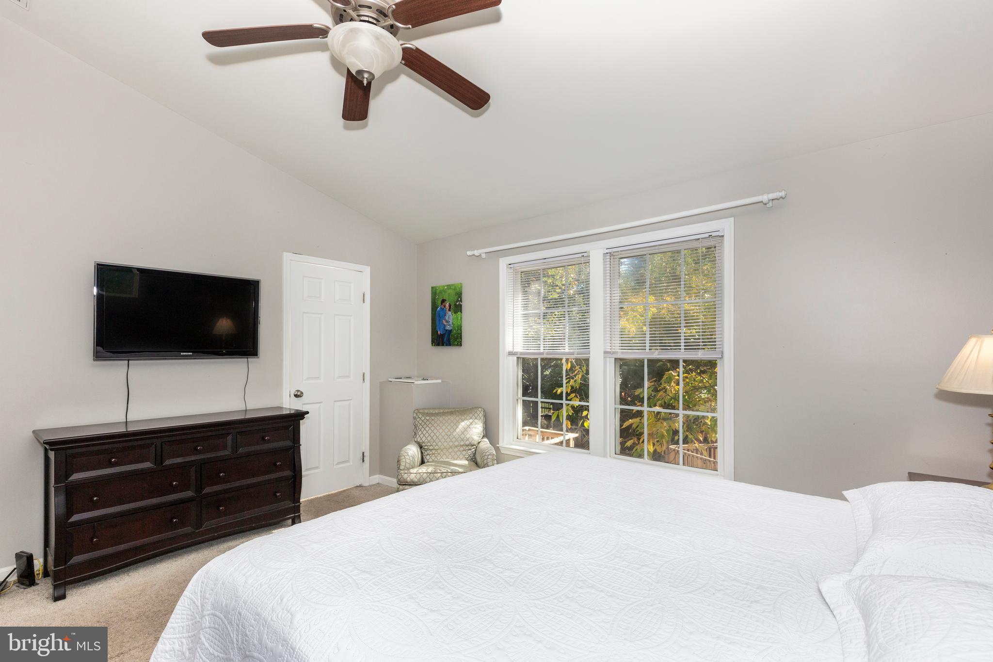 314 Huntinghorn Street Taneytown, MD 21787 - Photo 27 of 47 a bedroom with a bed and a flat screen tv