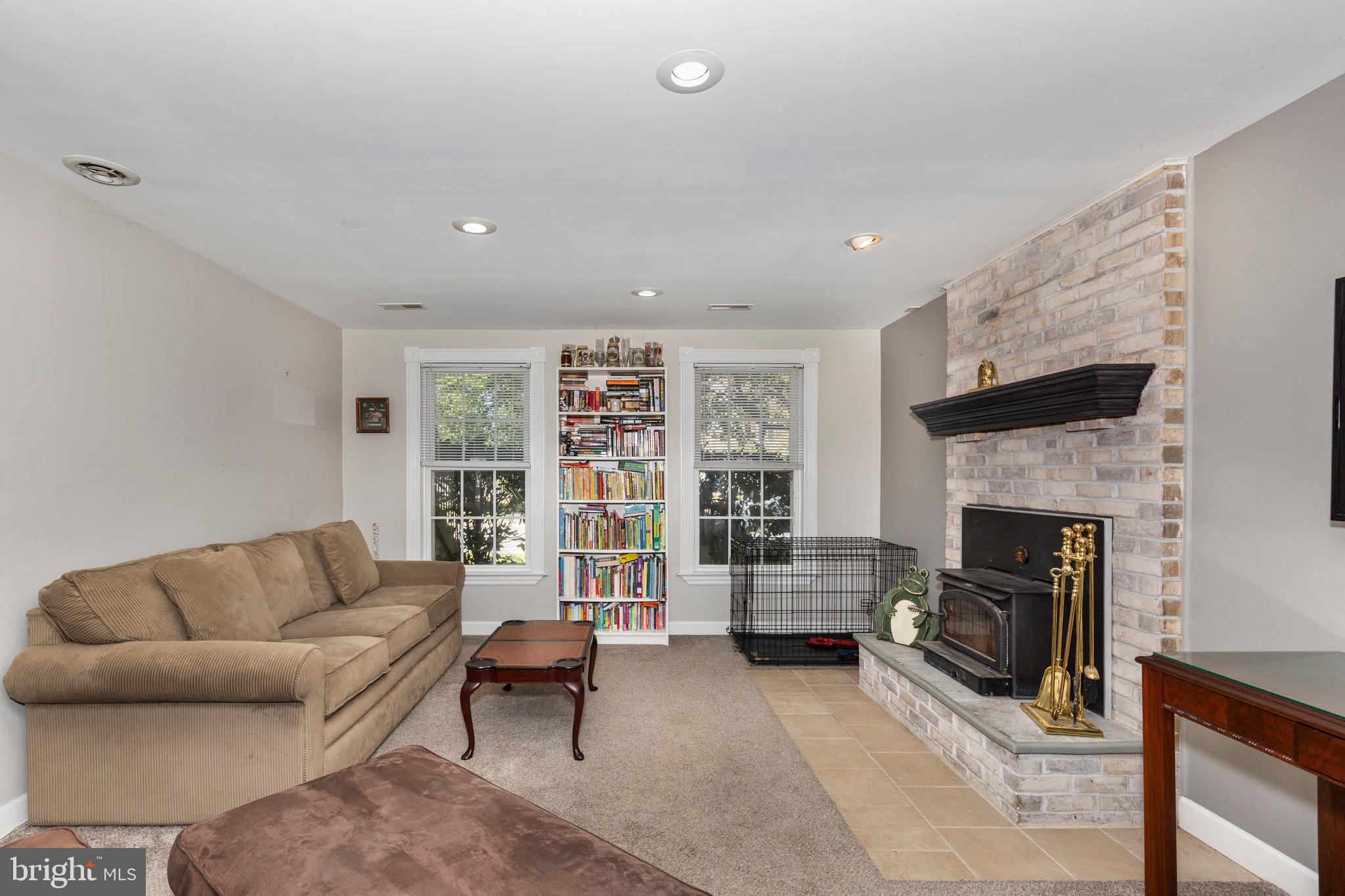 314 Huntinghorn Street Taneytown, MD 21787 - Photo 40 of 47 a living room with furniture and a fireplace
