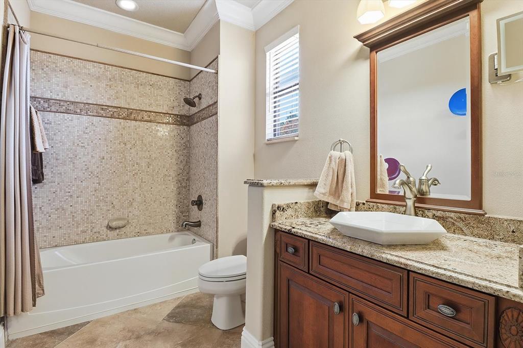 1416 North Ridge Meadow Path Hernando, FL 34442 - Photo 48 of 68 a bathroom with a granite countertop sink toilet and shower