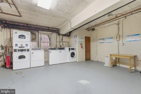 a view of a storage & utility room with washer and dryer