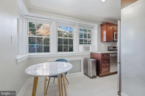 a view of kitchen with furniture and window