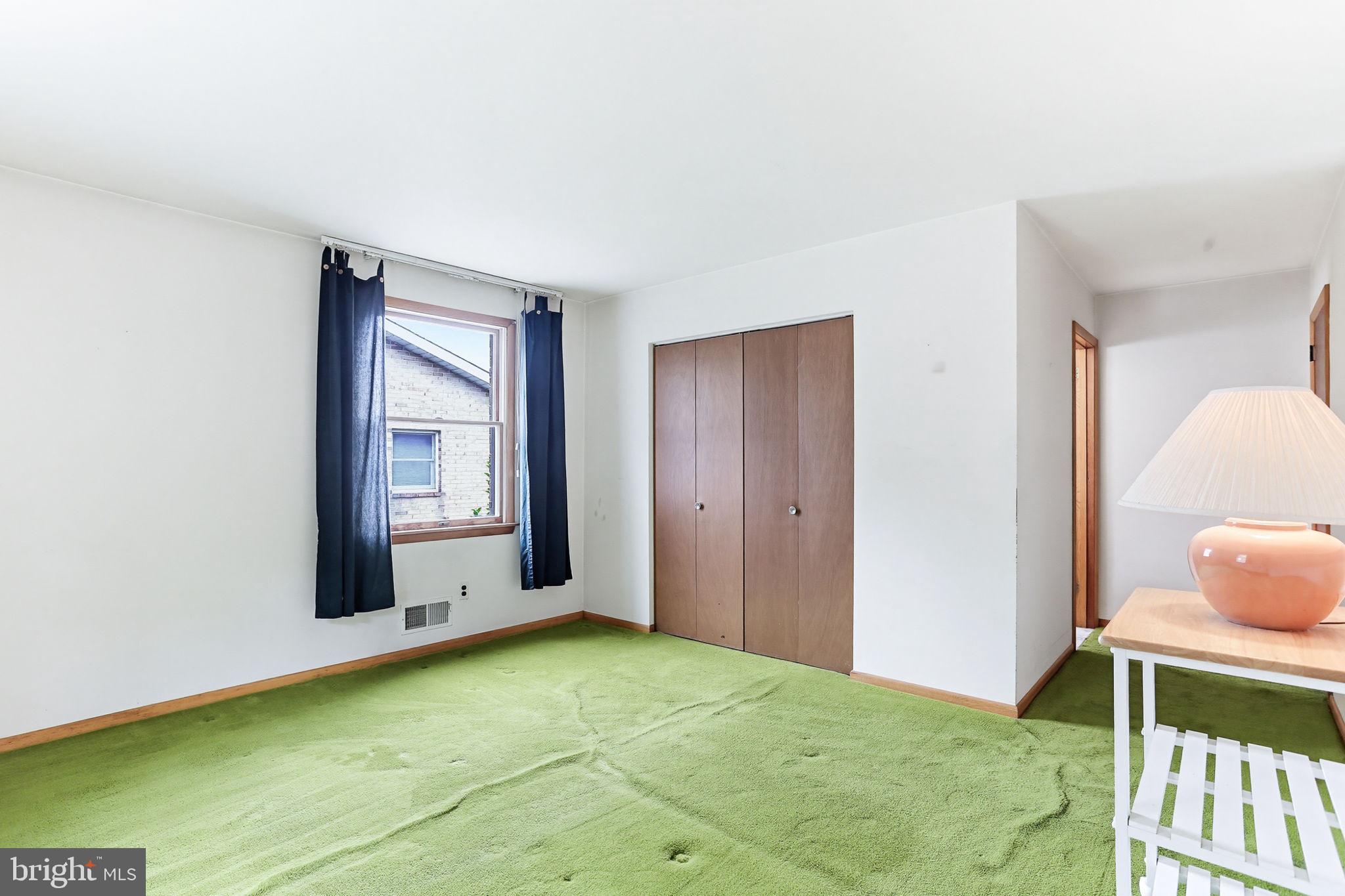 9301 Gardenia Road Baltimore, MD 21236 - Photo 27 of 37 a view of an empty room with window and wooden floor