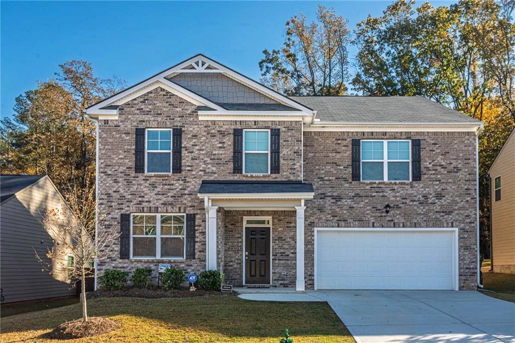 5381 Flat Rock Point Stonecrest, GA 30038 - Photo 1 of 53 a front view of a house with a yard