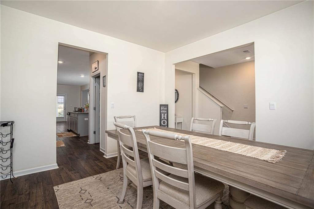 5381 Flat Rock Point Stonecrest, GA 30038 - Photo 12 of 53 a living room with furniture and a wooden floor