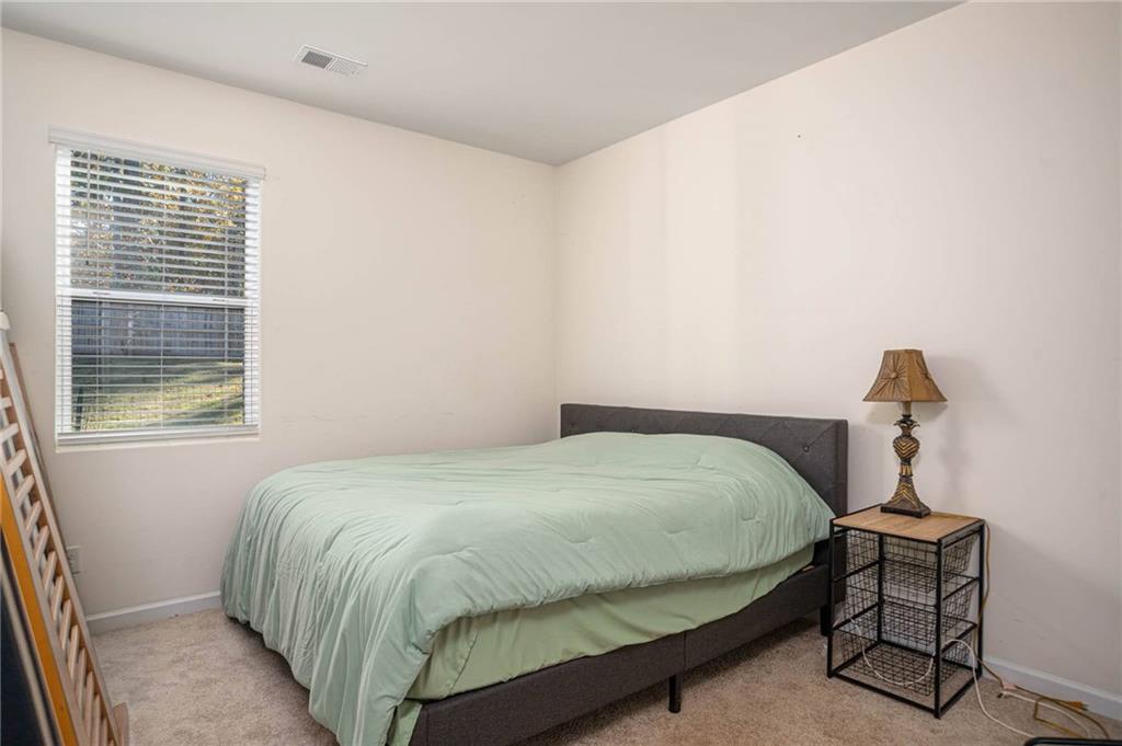 5381 Flat Rock Point Stonecrest, GA 30038 - Photo 18 of 53 a bedroom with a bed and a window