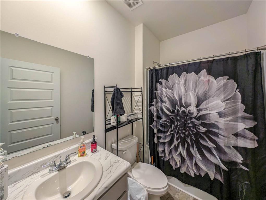 5381 Flat Rock Point Stonecrest, GA 30038 - Photo 20 of 53 a bathroom with a sink toilet and shower
