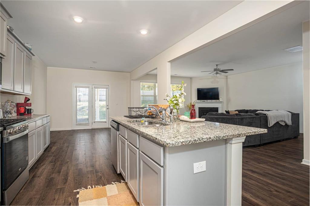 5381 Flat Rock Point Stonecrest, GA 30038 - Photo 21 of 53 a kitchen with sink stove and cabinets