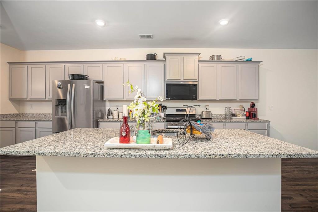 5381 Flat Rock Point Stonecrest, GA 30038 - Photo 25 of 53 a kitchen with refrigerator and a sink