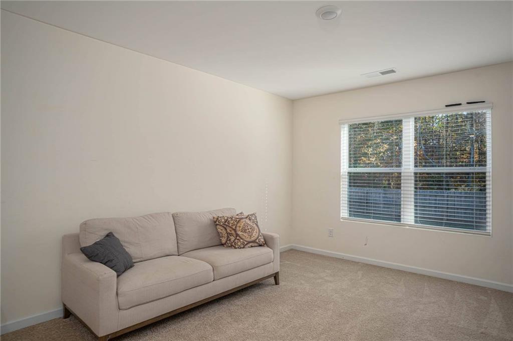 5381 Flat Rock Point Stonecrest, GA 30038 - Photo 29 of 53 a living room with furniture and a window