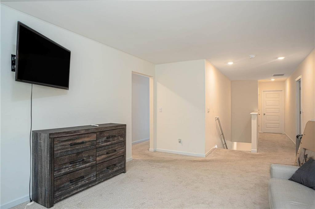 5381 Flat Rock Point Stonecrest, GA 30038 - Photo 30 of 53 a view of room with wooden floor and flat screen tv