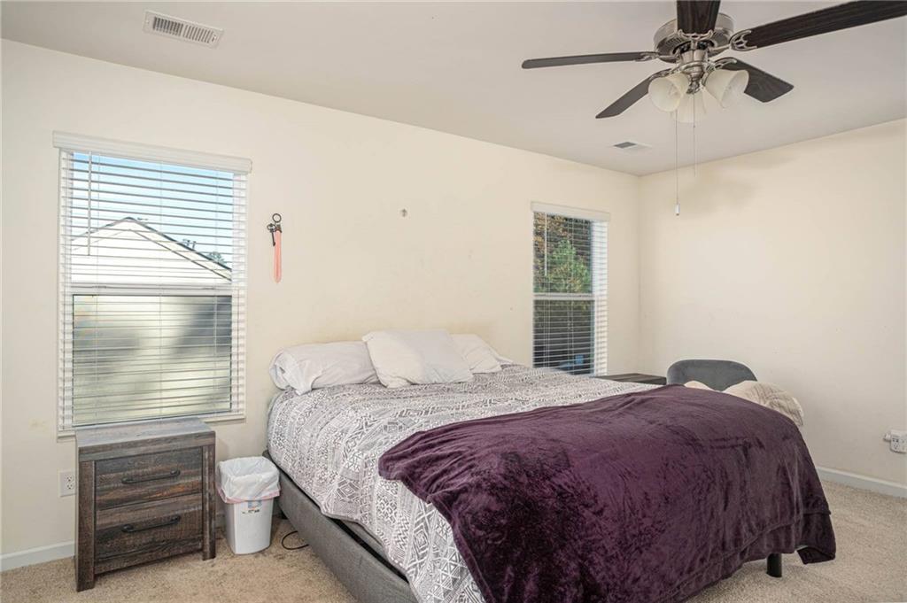 5381 Flat Rock Point Stonecrest, GA 30038 - Photo 32 of 53 a bedroom with a bed and a window