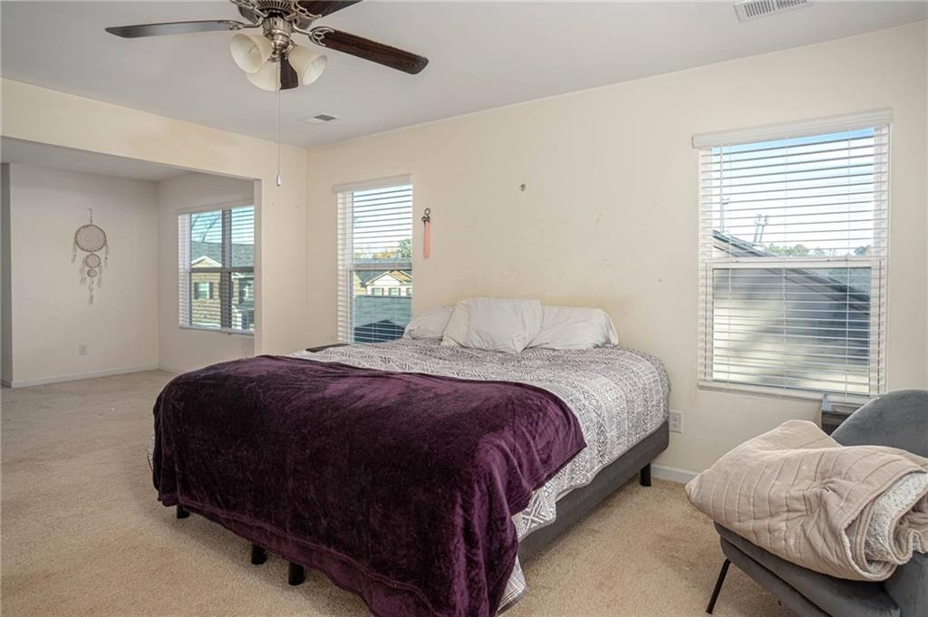 5381 Flat Rock Point Stonecrest, GA 30038 - Photo 33 of 53 a bedroom with a bed and window