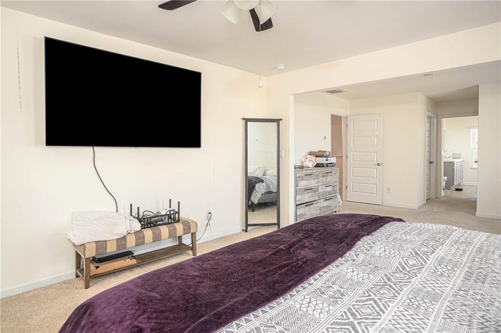 5381 Flat Rock Point Stonecrest, GA 30038 - Photo 34 of 53 a bedroom with a bed and a flat screen tv