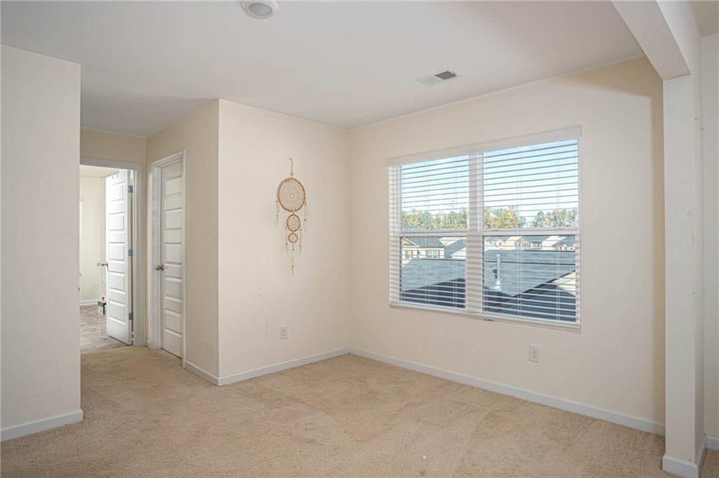 5381 Flat Rock Point Stonecrest, GA 30038 - Photo 35 of 53 a view of an empty room with a window