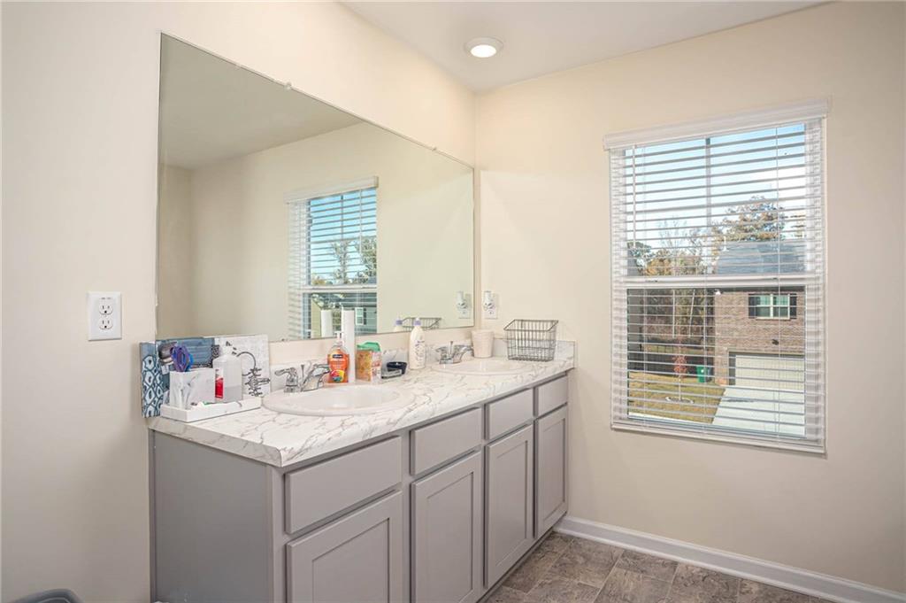 5381 Flat Rock Point Stonecrest, GA 30038 - Photo 37 of 53 a bathroom with a sink and a window