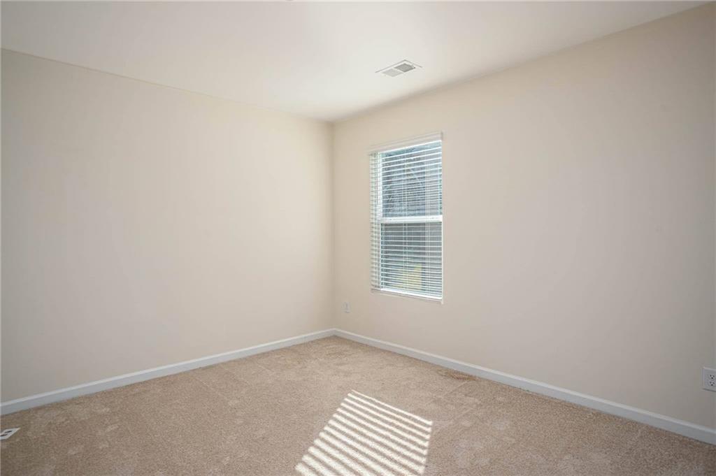 5381 Flat Rock Point Stonecrest, GA 30038 - Photo 38 of 53 a view of an empty room with a window