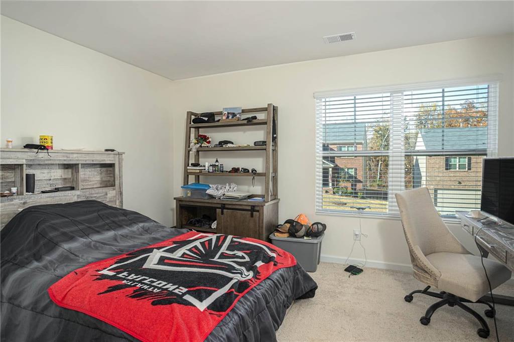 5381 Flat Rock Point Stonecrest, GA 30038 - Photo 40 of 53 a bedroom with a bed and a window