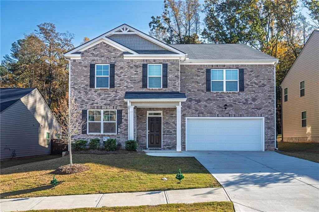 5381 Flat Rock Point Stonecrest, GA 30038 - Photo 4 of 53 a front view of a house with a yard