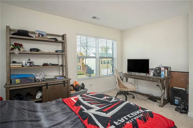 a view of a workspace with furniture