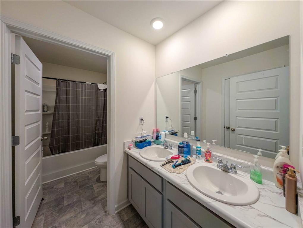 5381 Flat Rock Point Stonecrest, GA 30038 - Photo 42 of 53 a bathroom with a sink double vanity and shower