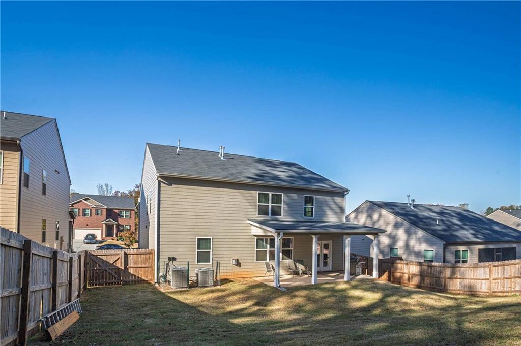 5381 Flat Rock Point Stonecrest, GA 30038 - Photo 46 of 53 a front view of a house with a yard