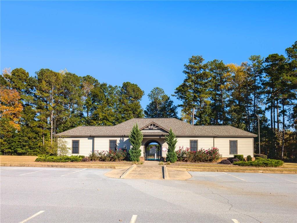 5381 Flat Rock Point Stonecrest, GA 30038 - Photo 48 of 53 a front view of a house with a yard and garage