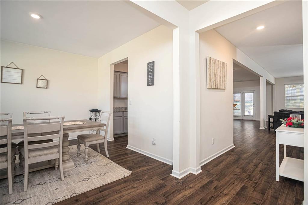 5381 Flat Rock Point Stonecrest, GA 30038 - Photo 7 of 53 a view of a dining room with furniture and wooden floor